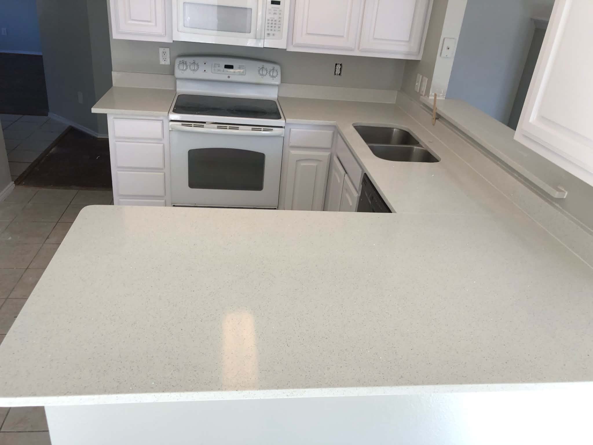 Kitchen with white countertops and island