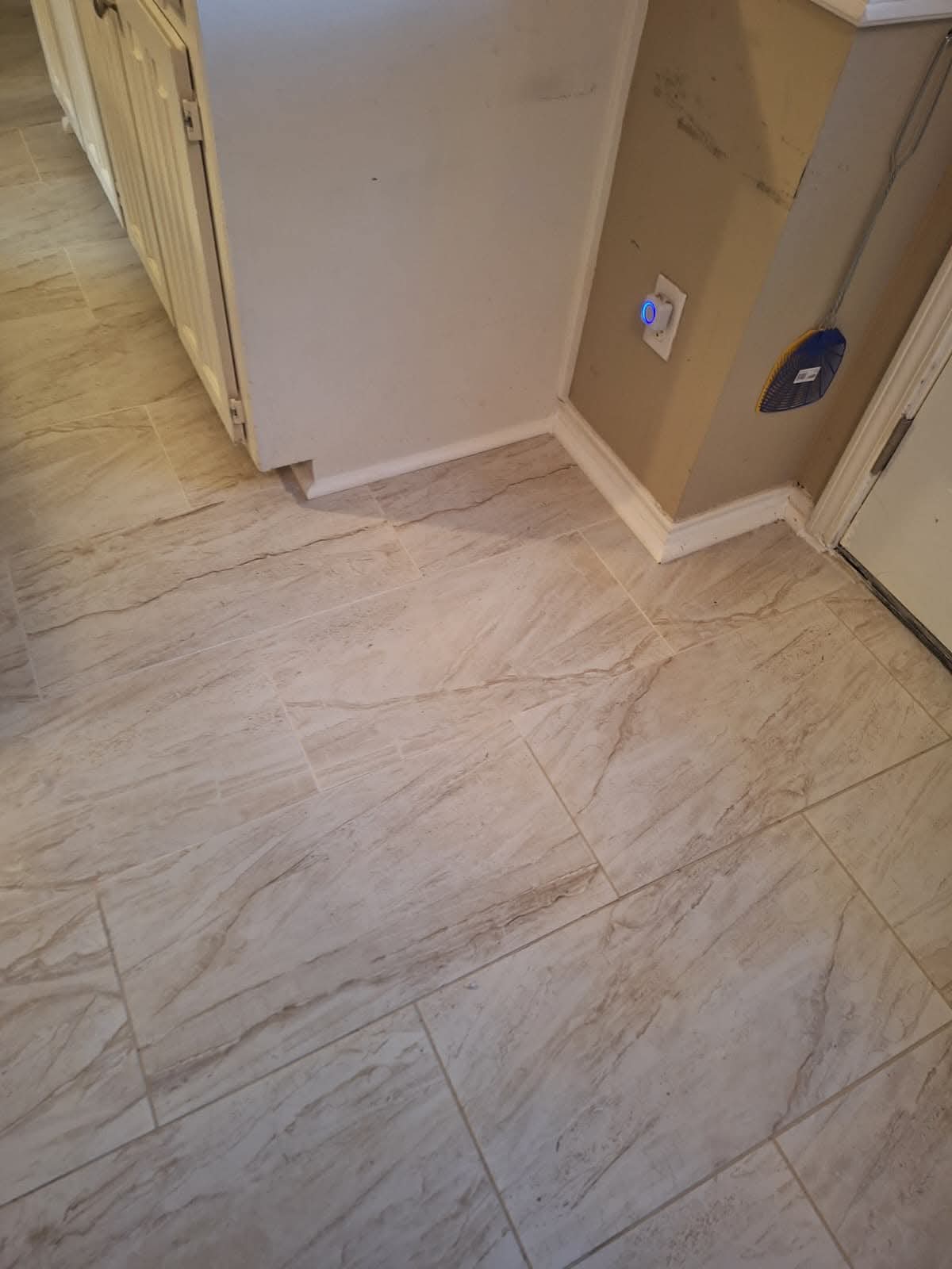 Marble tile flooring with smart doorbell