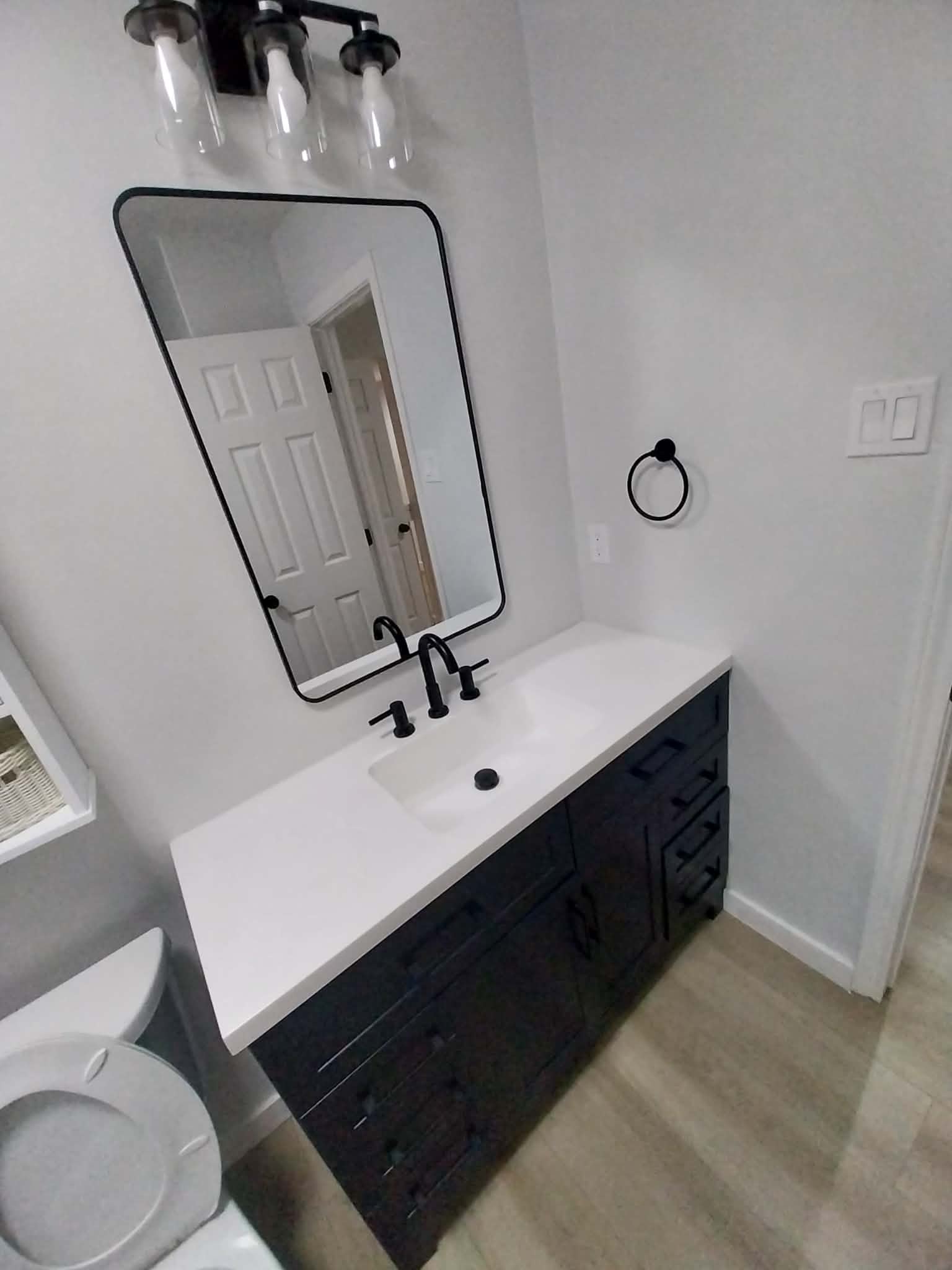 Modern bathroom vanity with black fixtures