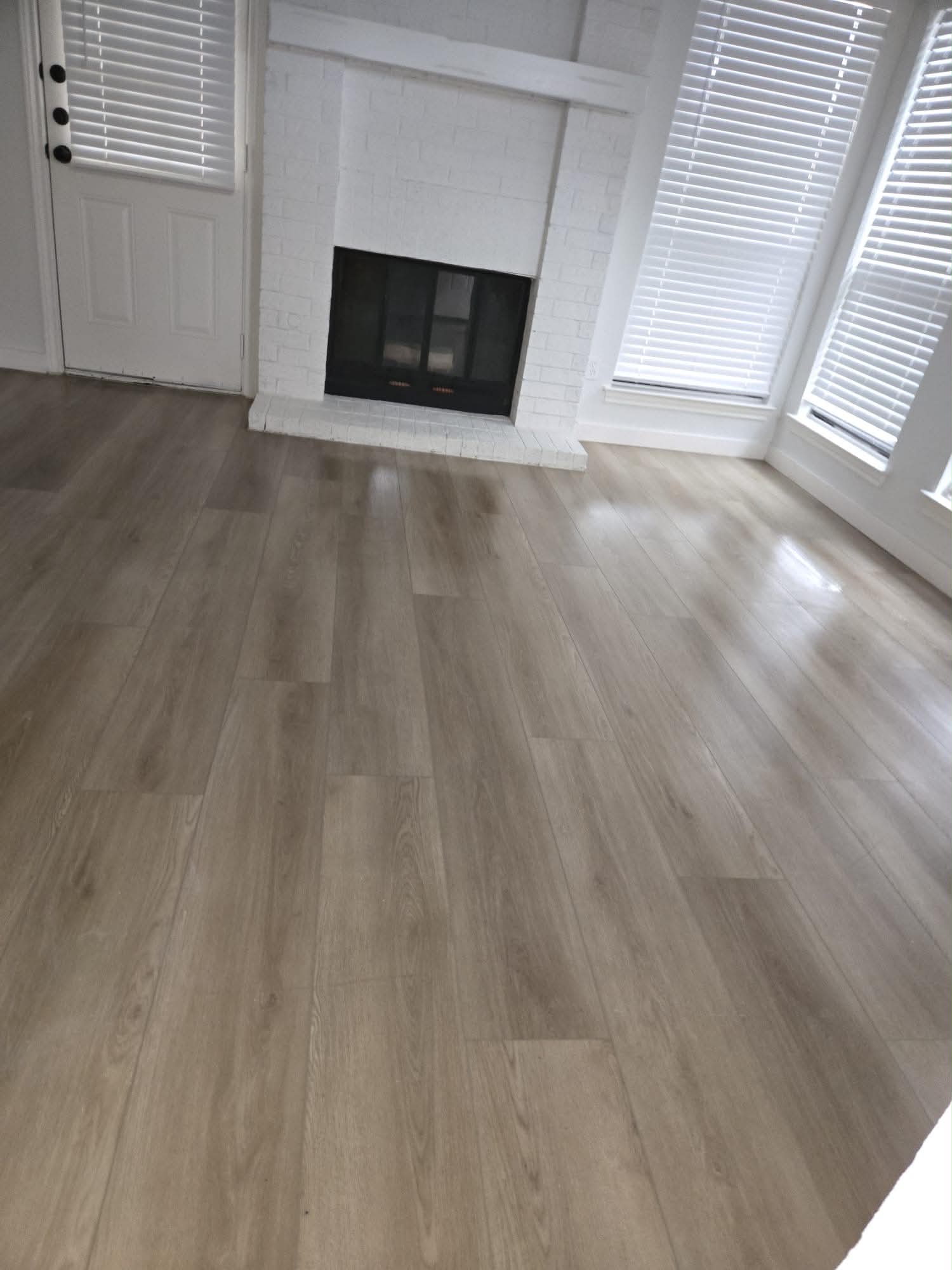 Living room with fireplace and laminate flooring