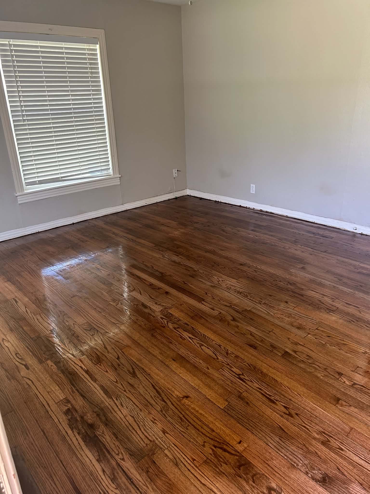 Refinished hardwood floors in bedroom