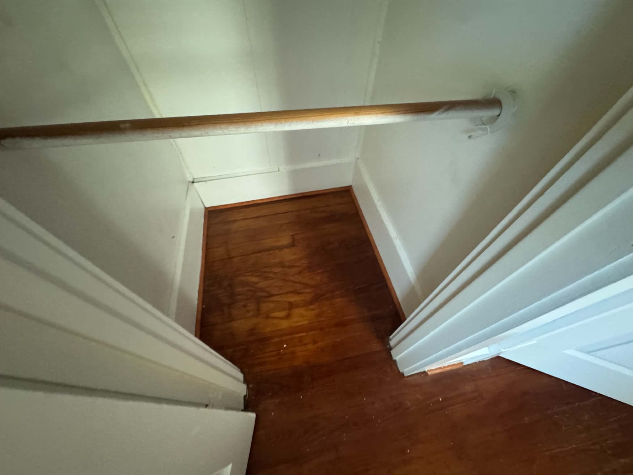 Closet with hardwood floors
