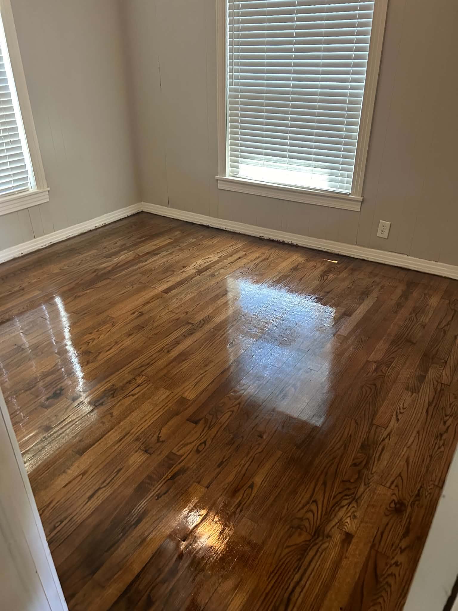 Refinished hardwood floors in bedroom