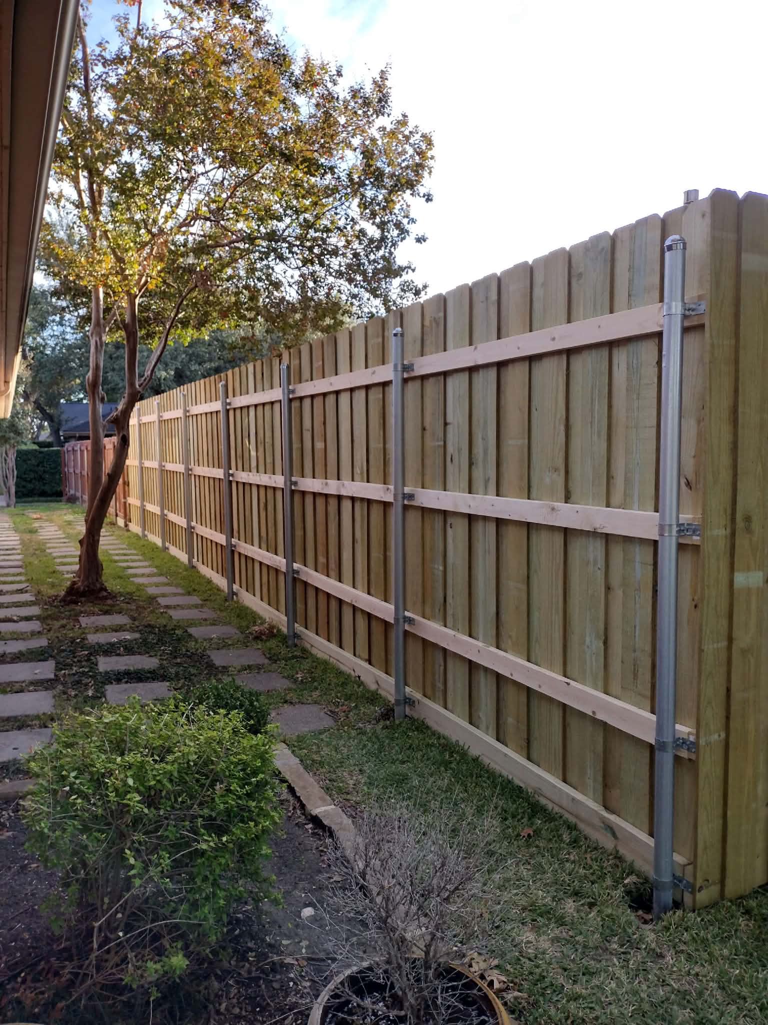 Long fence with metal posts